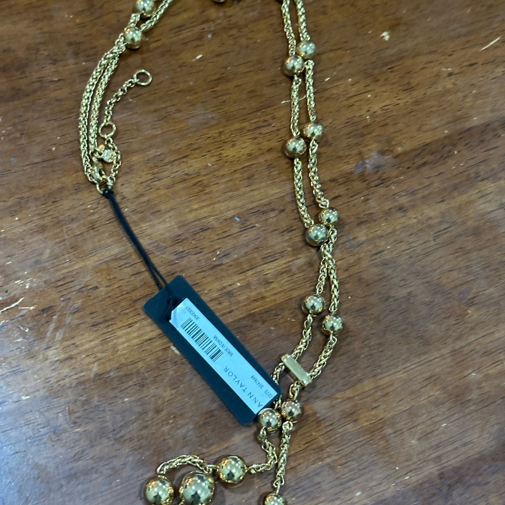Long gold bead lariat style necklace